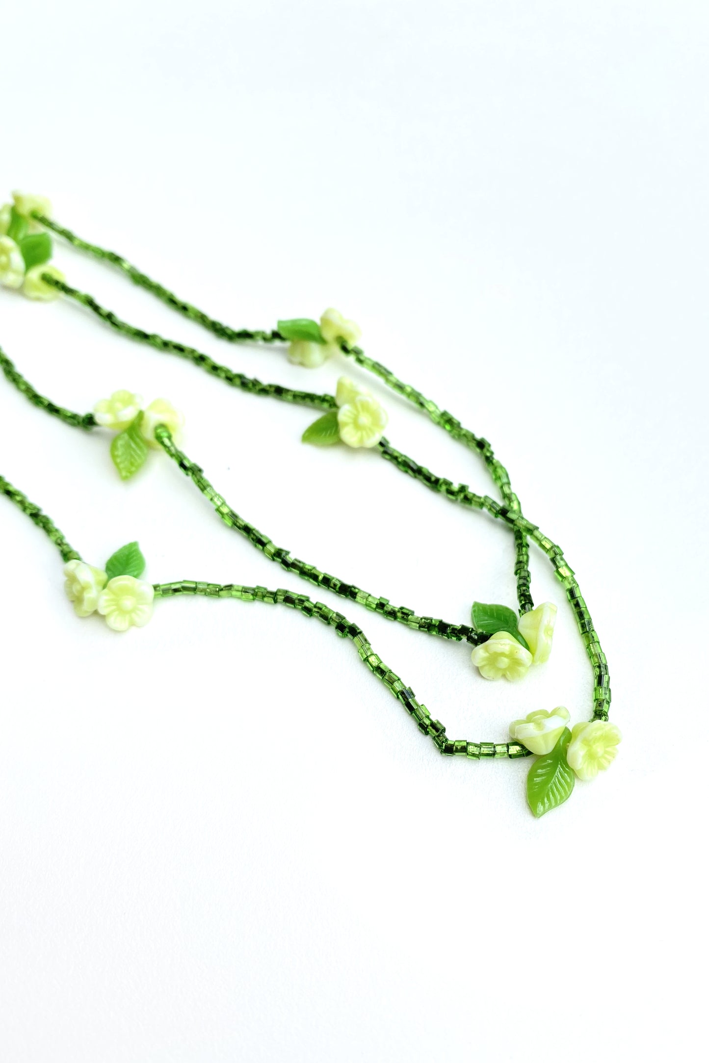 petite green seed bead and flower long necklace