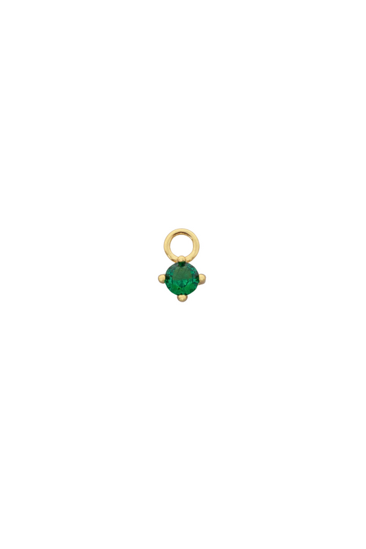 Gold pendant with a green gemstone on a white background